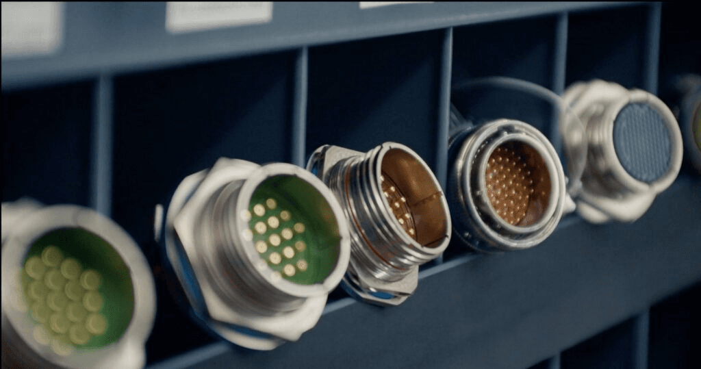 Wires with various connector types sitting side-by-side in a bin